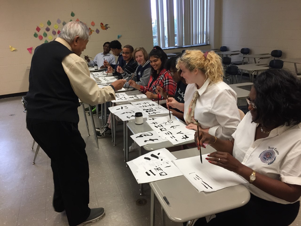 guest-speaker-mr-l-teaches-chinese-calligraphy-for-monthly-cultural